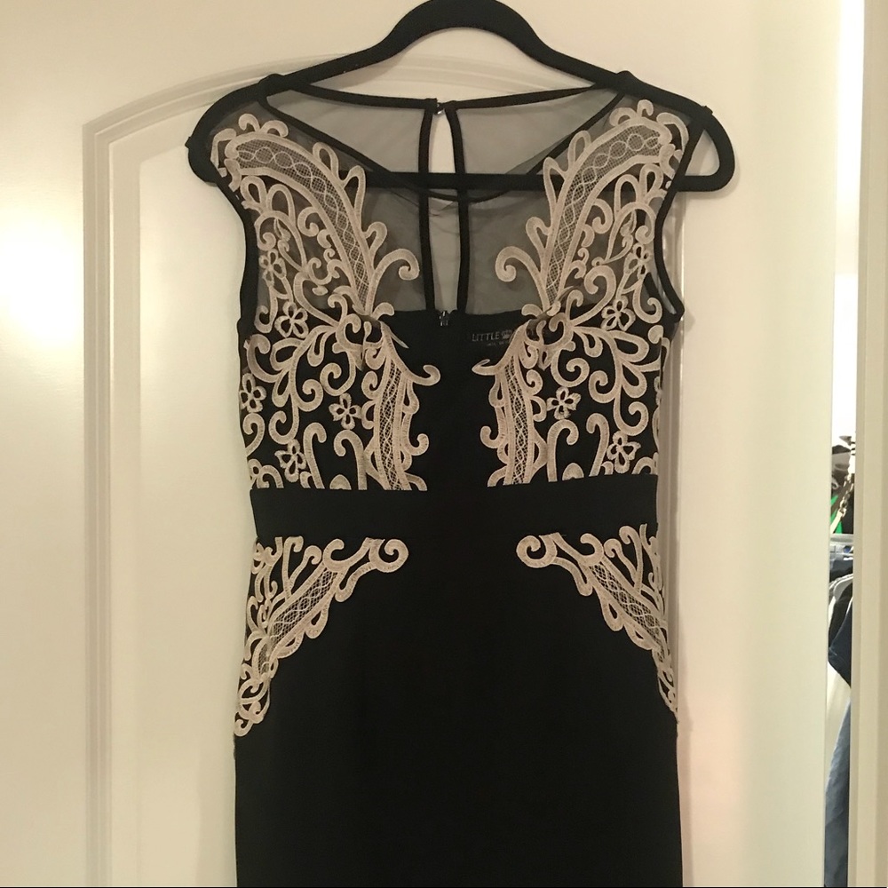 Fitted black cocktail dress.